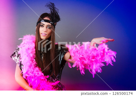 Girl pink plume and black feather on head. Carnival. Girl pink plume and black feather on head. Carnival. 126500174