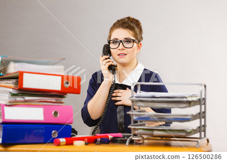 Business woman in office talking on phone 126500286