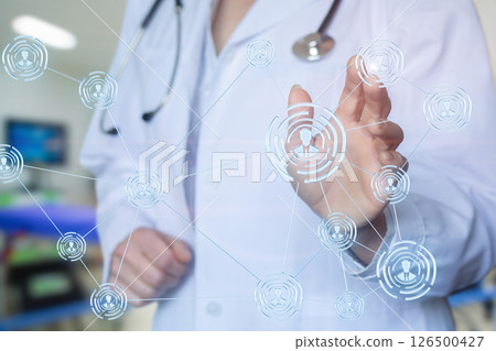 Doctor interacts with virtual medical network Doctor interacts with virtual medical network 126500427