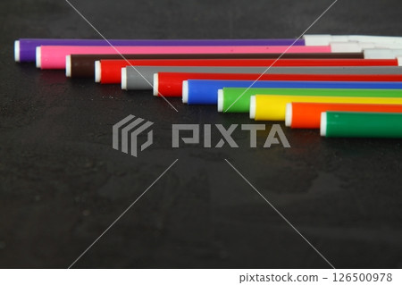 Multi-colored markers for drawing. Markers on a black isolated background 126500978