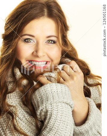 Woman showing her soft turtleneck Woman showing her soft turtleneck 126501168