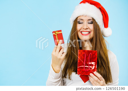 Happy Christmas woman holds red gift box Happy Christmas woman holds red gift box 126501190