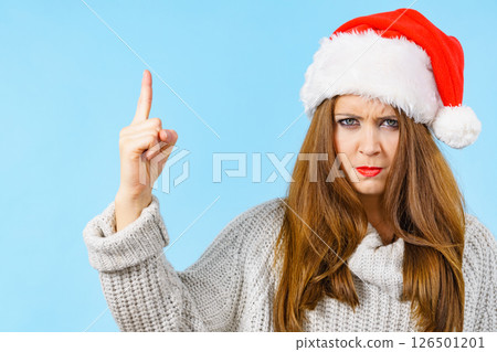 Woman threatens with finger, serious face expression 126501201