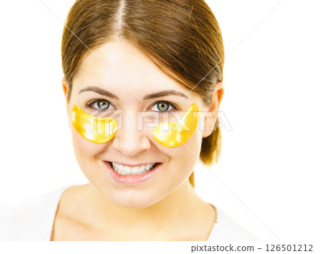 Woman with gold patches under eyes 126501212