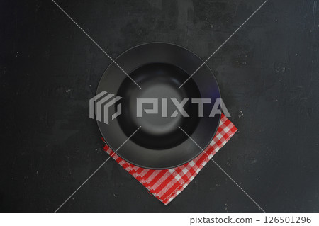 Empty black slate plate on dark stone table. Food background for menu, recipe Empty black slate plate on dark stone table. Food background for menu, recipe 126501296