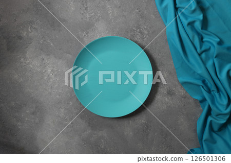 Empty blue plate on wooden table. Food background for menu. Flatlay, top view. Empty blue plate on wooden table. Food background for menu. Flatlay, top view. 126501306