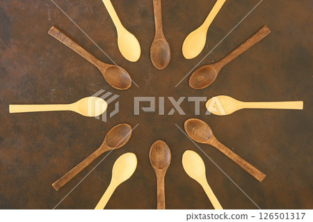 old empty spoons on wooden background 126501317