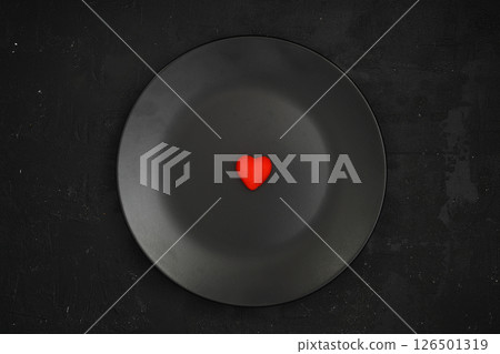 Creative concept food holiday valentines day love photo of heart on plate dish on black background. 126501319