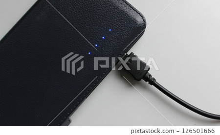 Blue diodes of charging scale indicates the full charge of the power bank isolated on white Blue diodes of charging scale indicates the full charge of the power bank isolated on white 126501666
