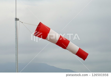Landscape with red and white flags 126501938