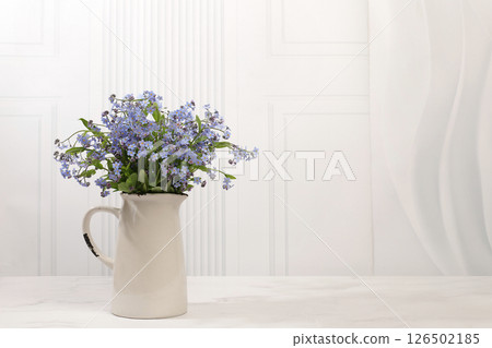 Abstract flower arrangement,Beautiful spring forget-me-not flowers in vase on light background,flyer. still life and template for design,floral holiday card and summer greeting concept, Abstract flower arrangement,Beautiful spring forget-me-not flowers in vase on light background,flyer. still life and template for design,floral holiday card and summer greeting concept, 126502185