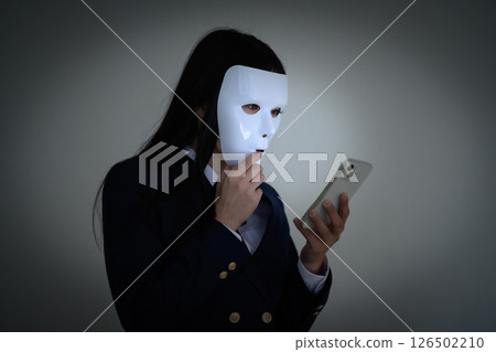High school girls wearing masks and looking at their smartphones: Bullying, school refusal, SNS troubles, shady part-time jobs High school girls wearing masks and looking at their smartphones: Bullying, school refusal, SNS troubles, shady part-time jobs 126502210