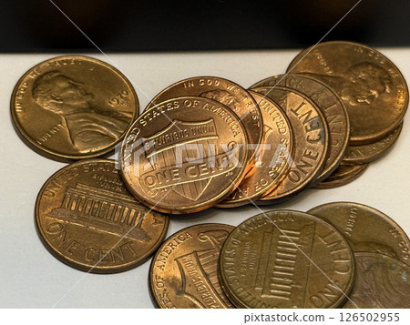 Scattered United States One Cent Penny Coins on White Background 126502955