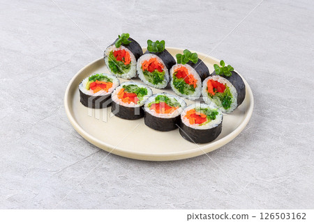 Colorful Vegan Maki Roll with Seaweed Salad and Microgreens Colorful Vegan Maki Roll with Seaweed Salad and Microgreens 126503162