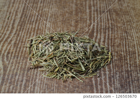 Dry organic background or texture of rosemary leaves. Healthy food concept . a wooden spoon with rosemary Dry organic background or texture of rosemary leaves. Healthy food concept . a wooden spoon with rosemary 126503670