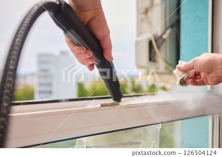 Efficiently Cleaning Windows with Advanced Steam Technology for a Spotless Crystal Clear View 126504124
