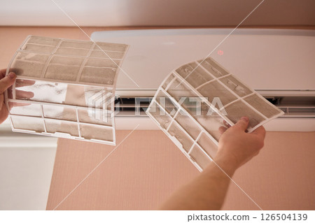 Performing regular cleaning of an Air Conditioner Filter can significantly enhance its efficiency Performing regular cleaning of an Air Conditioner Filter can significantly enhance its efficiency 126504139
