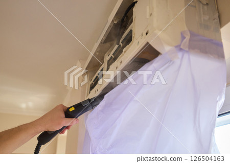 Regular steam cleaning and maintenance are essential for keeping your air conditioner optimal 126504163