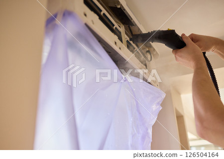 Regular steam cleaning and maintenance are essential for keeping your air conditioner optimal 126504164