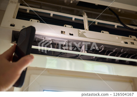 Performing regular cleaning of an Air Conditioner Filter can significantly enhance its efficiency Performing regular cleaning of an Air Conditioner Filter can significantly enhance its efficiency 126504167