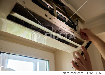 Performing regular cleaning of an Air Conditioner Filter can significantly enhance its efficiency Performing regular cleaning of an Air Conditioner Filter can significantly enhance its efficiency 126504169