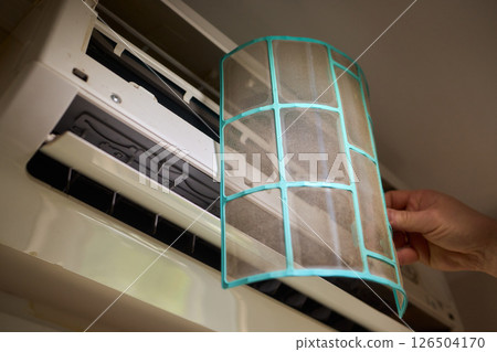 Performing regular cleaning of an Air Conditioner Filter can significantly enhance its efficiency Performing regular cleaning of an Air Conditioner Filter can significantly enhance its efficiency 126504170