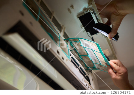 Performing regular cleaning of an Air Conditioner Filter can significantly enhance its efficiency Performing regular cleaning of an Air Conditioner Filter can significantly enhance its efficiency 126504171