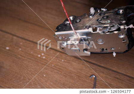 Hands Engaged in the Process of Performing Automotive Interior Repairs Effectively Hands Engaged in the Process of Performing Automotive Interior Repairs Effectively 126504177