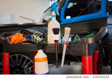 Important and Essential Car Detailing Tools and Accessories in a Modern Garage Setting for Cars Important and Essential Car Detailing Tools and Accessories in a Modern Garage Setting for Cars 126504183