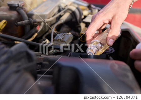 Maintaining Your Vehicle An In Depth Look at Performing an Oil Check in Action Today 126504371