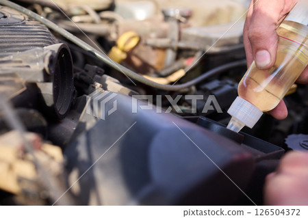 Maintaining Your Vehicle An In Depth Look at Performing an Oil Check in Action Today 126504372