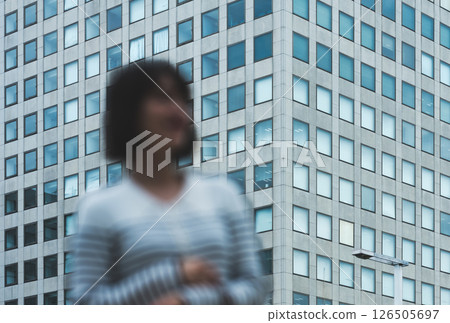 Buildings and blurred people Buildings and blurred people 126505697
