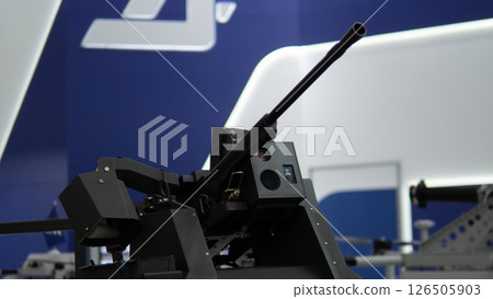 Innovative gun systems are presented at a military technology exhibition where various defense solutions are showcased, emphasizing advancements in weaponry design. Innovative gun systems are presented at a military technology exhibition where various defense solutions are showcased, emphasizing advancements in weaponry design. 126505903