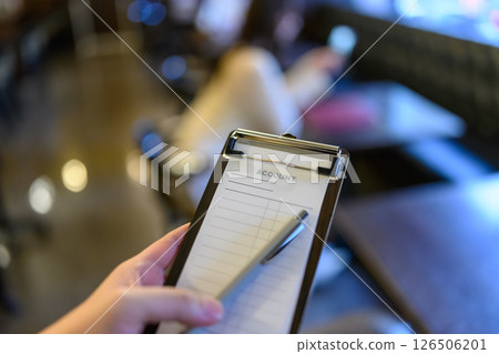 Taking orders with a clipboard 126506201