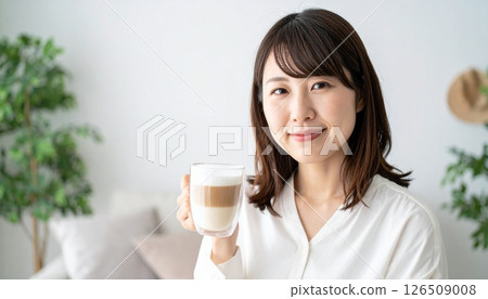 Enjoy the comfort of a cafe latte in a modern living room Enjoy the comfort of a cafe latte in a modern living room 126509008