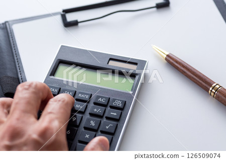 Black calculator and binder Black calculator and binder 126509074