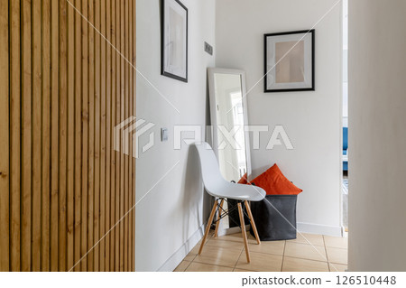 Bright Minimalist Hallway with Chair and Wooden Wall Bright Minimalist Hallway with Chair and Wooden Wall 126510448
