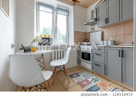 Bright Kitchen Nook with Modern Appliances 126510453