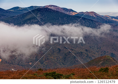 The cloud-filled Azuma mountain range seen from Mt. Adatara and Mt. Minowa in autumn colors The cloud-filled Azuma mountain range seen from Mt. Adatara and Mt. Minowa in autumn colors 126512479