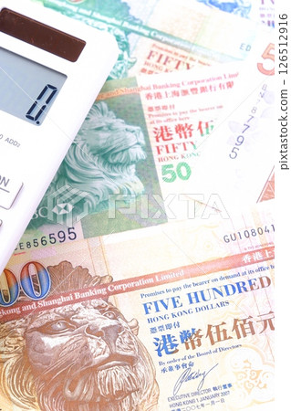 Hong Kong currency, Hong Kong dollar (HKD) banknotes and calculator 126512916