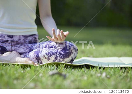 Japanese woman enjoying yoga in nature 126513470