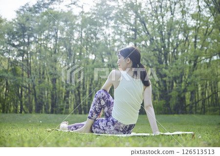 Japanese woman enjoying yoga in nature Japanese woman enjoying yoga in nature 126513513