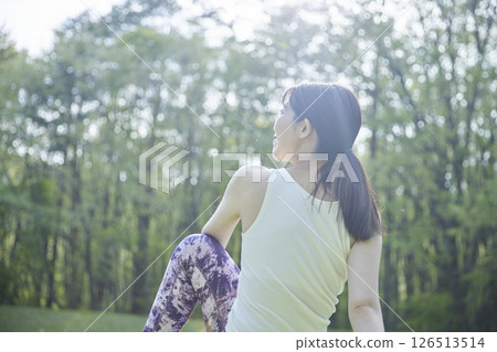 Japanese woman enjoying yoga in nature 126513514