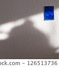 Naturally lit walls and blue painting 126513736