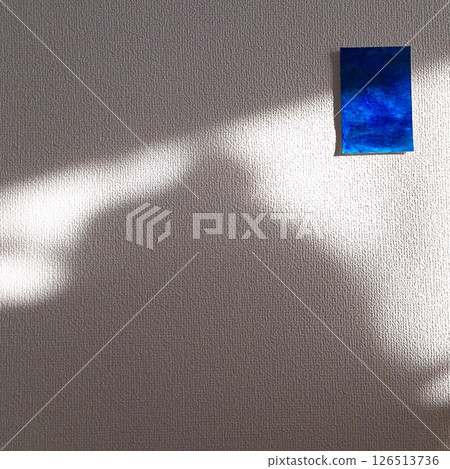 Naturally lit walls and blue painting 126513736