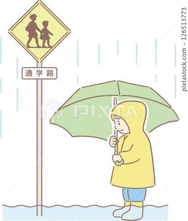 An elementary school boy is unable to walk on a school route flooded by heavy rain 126513773