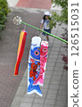 A new carp streamer on the balcony and elementary school students on their way to school 126515031