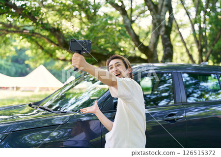 Man taking a selfie with a camera 126515372
