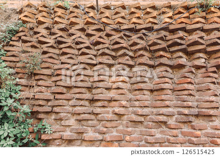 Wall of old red bricks with unusual masonry in Rome, Italy. High quality photo 126515425