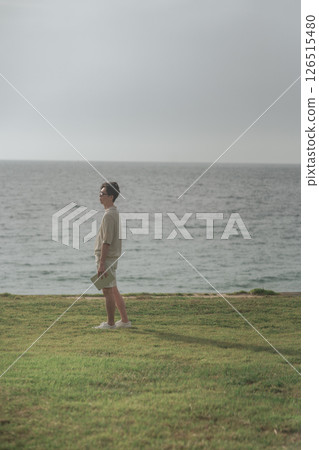 A man in his 30s working remotely at a resort 126515480